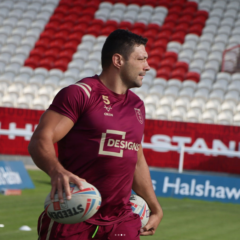 Hull Kingston Rovers player in training kit with Designs branding on the front.