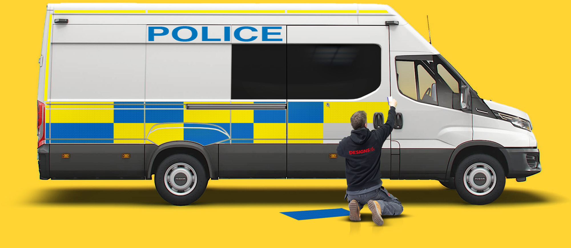 Designs employee fitting graphic to police van.