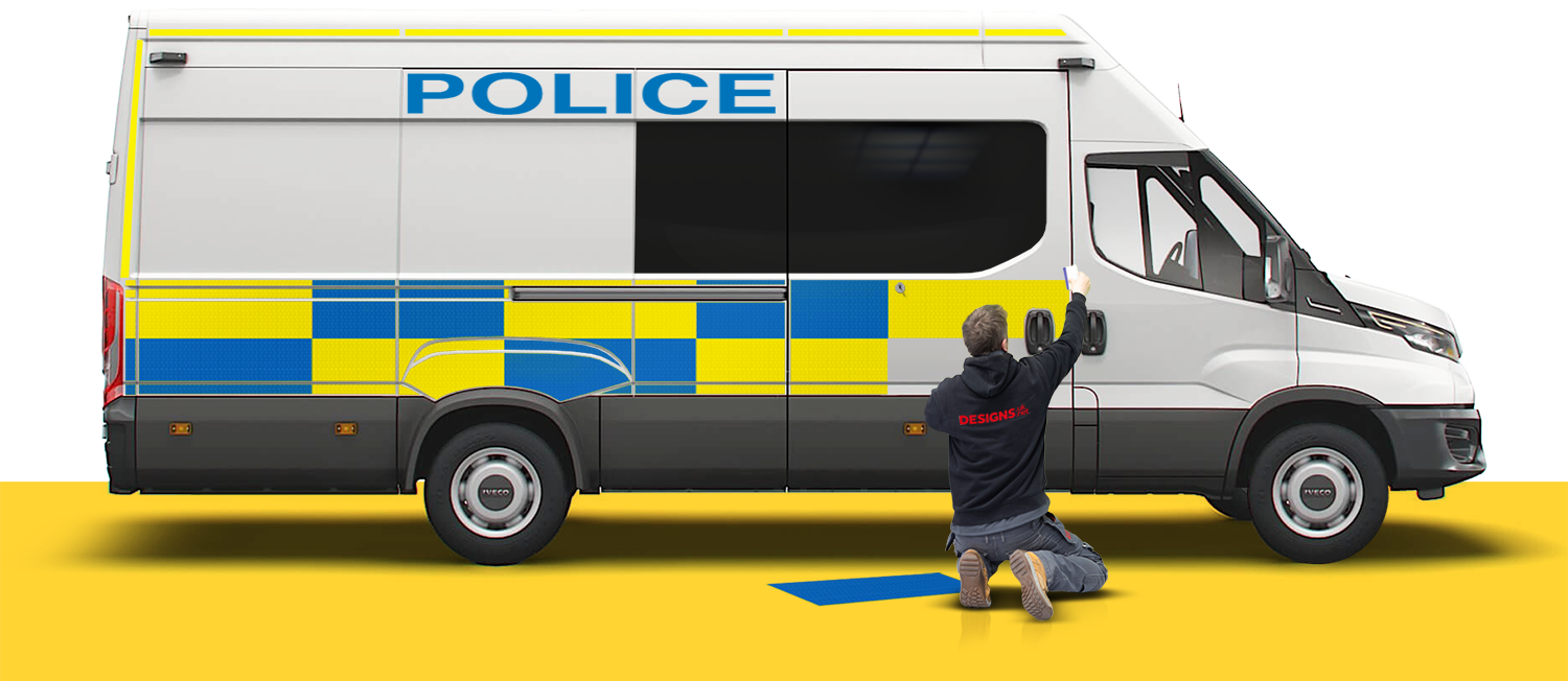 Designs employee fitting graphic to police van.